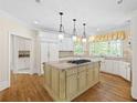 Spacious kitchen featuring a granite island, stainless steel appliances, and hardwood floors at 320 Yellowroot Ln, Sandy Springs, GA 30350