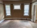 Neutral bedroom featuring light-filled windows and carpeted floor, offering a comfortable retreat at 389 Dargan Sw Pl, Atlanta, GA 30310