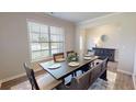 Elegant dining space with a classic table and a view into other living areas at 4535 Sunflower Cir, Cumming, GA 30040