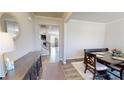 Light and airy dining room featuring hardwood floors and modern furnishings at 4535 Sunflower Cir, Cumming, GA 30040