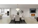 Elegant dining room with stylish seating, modern light fixture, and an adjacent cozy living space at 1161 Dahlonega Hwy # 3, Cumming, GA 30040