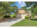 Beautiful single-Gathering home offers mature trees, a well-maintained lawn, and a convenient two-car garage at 4535 Vanadium Bnd, Cumming, GA 30040