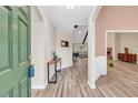 Welcoming foyer with wood-look floors and view to the living room at 502 Stoneland Pl, Lawrenceville, GA 30046