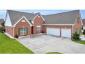 Lovely brick home boasting a spacious driveway and two-car garage at 502 Stoneland Pl, Lawrenceville, GA 30046