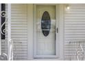 Elegant front door with decorative glass detailing, offering a warm welcome and enhancing curb appeal at 8185 Rivertown Rd, Fairburn, GA 30213