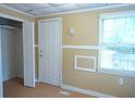 Bedroom with a closet and a window providing natural light, freshly painted at 936 Glynn Oaks Dr, Clarkston, GA 30021