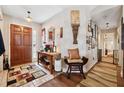 Welcoming foyer with neutral tile floor, wood accents, and elegant decor at 2080 Bankston Cir, Snellville, GA 30078