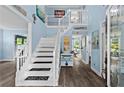 Bright foyer showcasing the staircase and stylish decor at 4365 Wicklow Ct, Suwanee, GA 30024