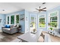 Bright eat-in kitchen features a painted picnic table and lots of windows providing natural light and pretty outdoor views at 4365 Wicklow Ct, Suwanee, GA 30024