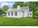 Attractive home featuring neat white siding and a lush green lawn at 6802 Ida St, Lithonia, GA 30058