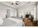 Large bedroom featuring hardwood flooring, recessed lighting, and a sitting area at 934 Elwood St, Dacula, GA 30019