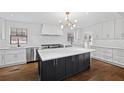 Modern kitchen featuring a large island, stainless steel appliances, and white subway tile backsplash at 1415 Dalewood Ne Dr, Atlanta, GA 30329