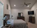 Relaxing bedroom with a ceiling fan, soft carpeting, neutral walls, and a full set of wooden furniture at 322 Woodridge Pass, Canton, GA 30114