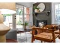 Bright living room with a stylish brick fireplace, modern furniture, and natural light from the windows and glass doors at 3580 Raymond Dr, Atlanta, GA 30340