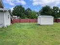 The spacious backyard includes a shed and a well-maintained green lawn at 60 King Blvd, Mcdonough, GA 30253