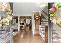 Elegant foyer showcases hardwood floors and stairs with detailed trim at 1540 Kinglet Ln, Marietta, GA 30062