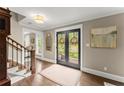 Inviting foyer with hardwood floors, a patterned rug, and front door at 1540 Kinglet Ln, Marietta, GA 30062