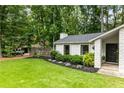 Welcoming home exterior with lush landscaping, a charming entryway, and a well-manicured front lawn at 171 North Trce, Alpharetta, GA 30009