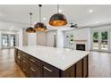 Kitchen featuring a large center island with bar seating, stainless steel appliances, and hardwood floors at 2153 Cooper Lake Se Rd, Smyrna, GA 30080