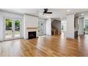 Bright living room with a fireplace, French doors to the outside, and hardwood floors at 2153 Cooper Lake Se Rd, Smyrna, GA 30080