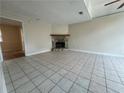 Spacious living room featuring tile flooring and a beautiful stone fireplace at 3722 Cherokee Overlook Dr, Canton, GA 30115