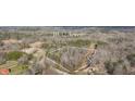 Aerial view of the 10.32 acre lot with trees and road access at 176 Old Burnt Hickory Rd, Douglasville, GA 30134