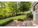 Manicured backyard with a brick-lined patio and lush landscaping, perfect for outdoor enjoyment at 937 Rosedale Ne Rd, Atlanta, GA 30306