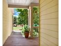 Inviting front porch featuring wooden floors and views of lush greenery at 34 Laurel Ne Way, White, GA 30184