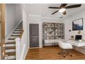 Bright office space featuring hardwood floors, modern furniture, and a functional built-in bookshelf for organization at 635 Broadview Ne Pl, Atlanta, GA 30324