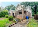 Brick home with front porch and a long driveway at 1615 Stokes Sw Ave, Atlanta, GA 30310