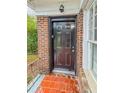 A black front door at 1615 Stokes Sw Ave, Atlanta, GA 30310