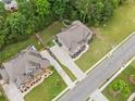 An aerial view of the property showing its location on a tree-lined street at 1898 Alcovy Shoals Se Blf, Lawrenceville, GA 30045