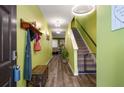 Inviting entryway with stylish decor, wood floors, and a staircase leading to the upper level at 510 Curry Ridge Ct, Locust Grove, GA 30248