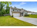 Beautiful two-story home featuring a two-car garage, well-kept lawn, and traditional design elements at 510 Curry Ridge Ct, Locust Grove, GA 30248
