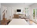 Open-concept living room with high ceilings, fireplace, and large windows at 4108 Wyndam Hill Dr, Suwanee, GA 30024