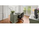 Bright office space with a classic desk and a comfortable chair with great natural light coming through the window at 4108 Wyndam Hill Dr, Suwanee, GA 30024