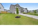Lovely home with lush green lawn, long driveway and exterior lighting at 537 Garnet Dr, Acworth, GA 30101