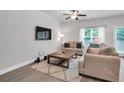 Cozy living room with neutral tones, a large window, and comfortable seating at 10151 Benton Woods Dr, Covington, GA 30014