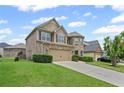 Inviting two-story home with brick accents, lush lawn, and an attached garage, radiating suburban charm at 29 Lankford Rd, Tucker, GA 30084