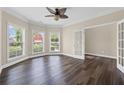 Inviting living room featuring large windows and beautiful wood-look floors, perfect for relaxation and entertaining at 29 Lankford Rd, Tucker, GA 30084
