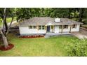 Beautiful single-story home with manicured lawn, freshly painted exterior, and inviting front porch at 3978 Oglesby Rd, Powder Springs, GA 30127