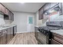 Modern kitchen with stainless steel appliances and updated countertops at 220 Harwell Nw Rd, Atlanta, GA 30331