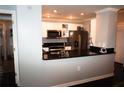 This kitchen is equipped with black countertops and ample cabinet storage at 3475 Oak Valley Ne Rd # 980, Atlanta, GA 30326