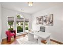 Bright office featuring three large windows, a white desk, and a comfortable chair at 667 Creswell Park, Smyrna, GA 30082