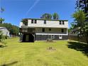 Spacious backyard with a wood deck and lush green grass, perfect for outdoor activities and relaxation at 2691 Old South Dr, Jonesboro, GA 30236