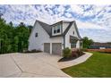 Spacious home with attached two-car garage and large driveway at 130 Lapis Lake Pt, Fayetteville, GA 30215