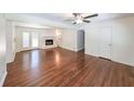 Bright living room with hardwood floors, fireplace, and access to backyard at 213 Linda Dr, Tucker, GA 30084
