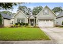 Charming one-story home with well-maintained lawn and a two car garage, with updated siding and trim at 3491 Amerigo Dr, Buford, GA 30519