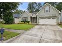 Charming one-story home with well-maintained lawn and a two car garage, with updated siding and trim at 3491 Amerigo Dr, Buford, GA 30519