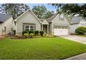 Charming one-story home with well-maintained lawn and a two car garage, with updated siding and trim at 3491 Amerigo Dr, Buford, GA 30519